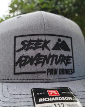 PNW Drives Seek Adventure Black Logo Hat